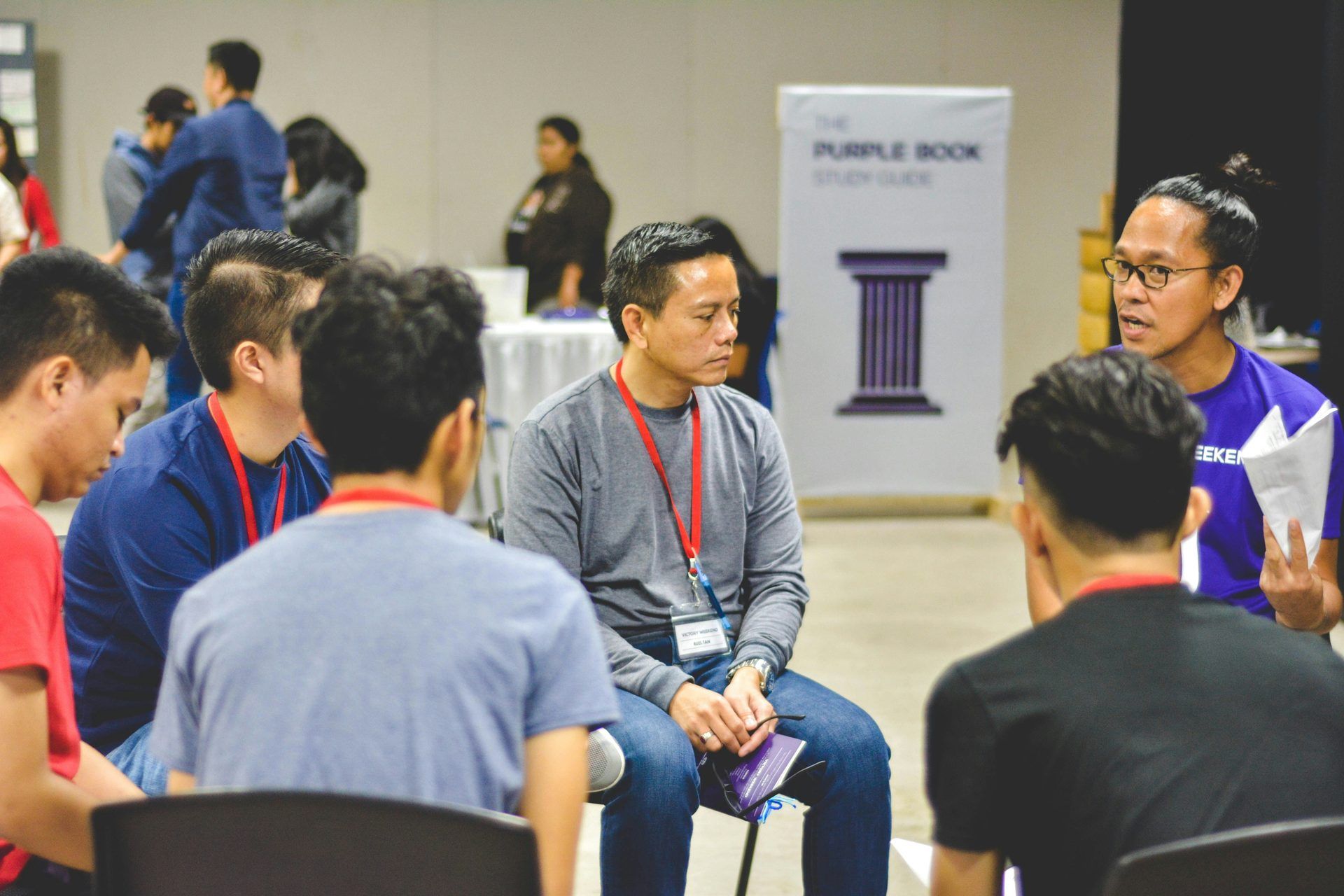 Colleagues in a small group discussion during a knowledge sharing session