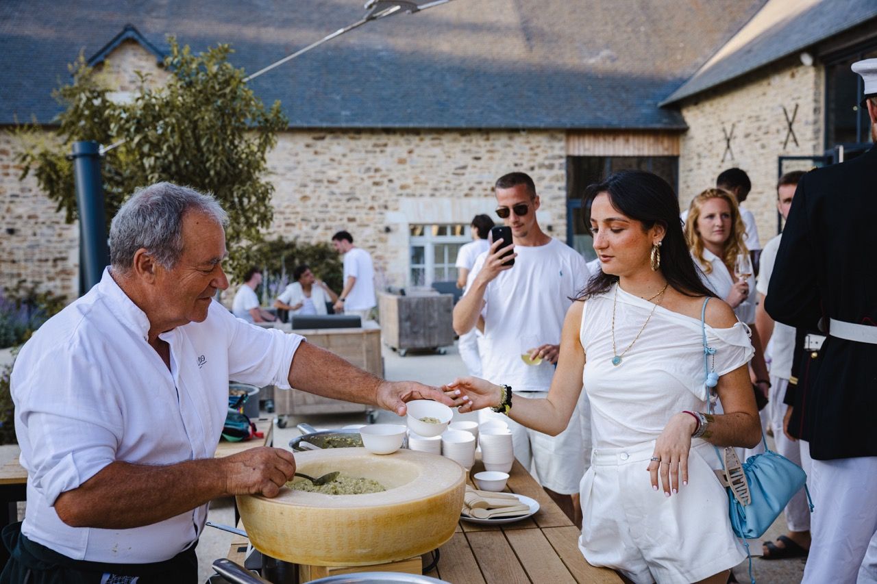 Team members cooking together during a culinary team building workshop