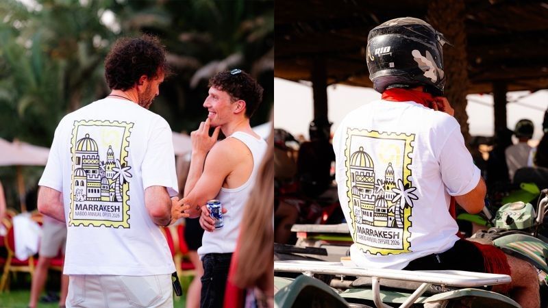 Colleagues in the Marrakesh offsite T-shirts chatting in the riad garden