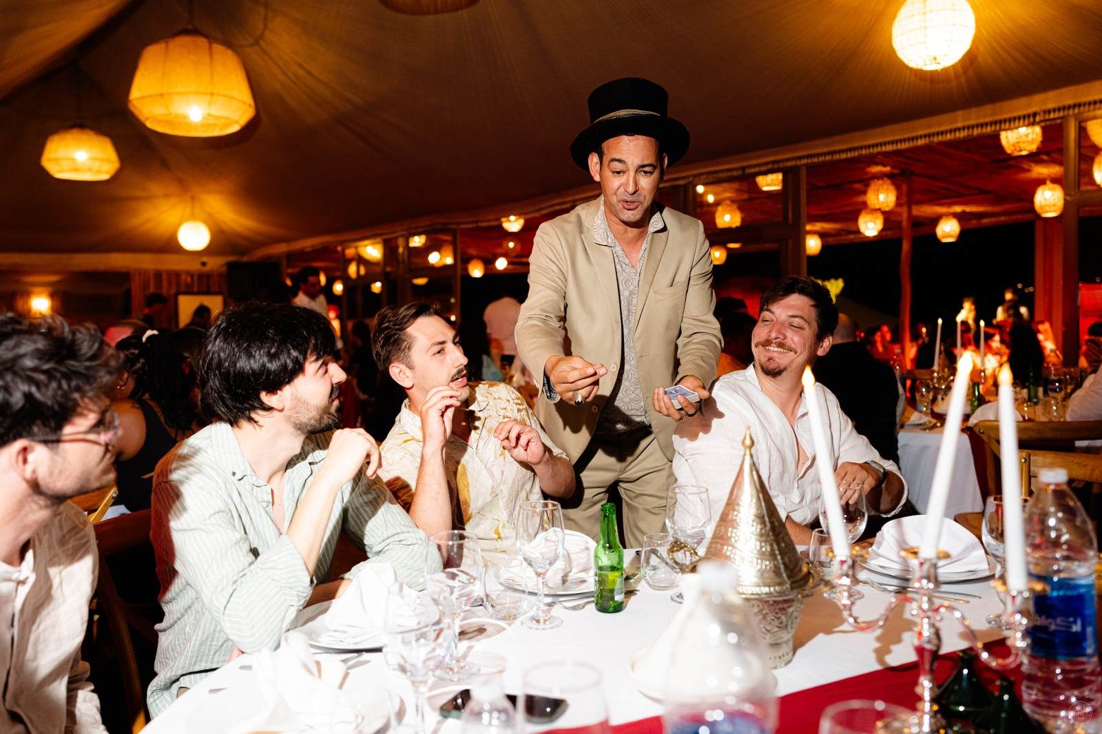Naboo team at a lantern-lit dinner during the desert evening of the company offsite in Marrakech