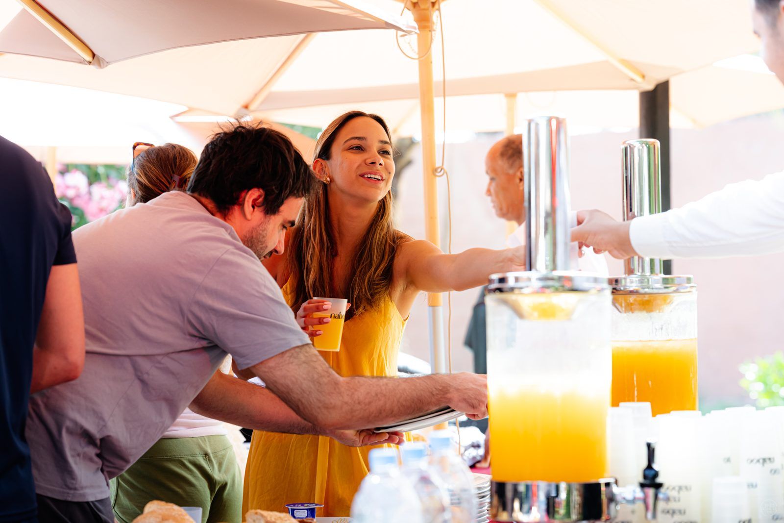 Fresh juice dispensers and Naboo cups at an outdoor drinks station during the Naboo team offsite in Marrakech