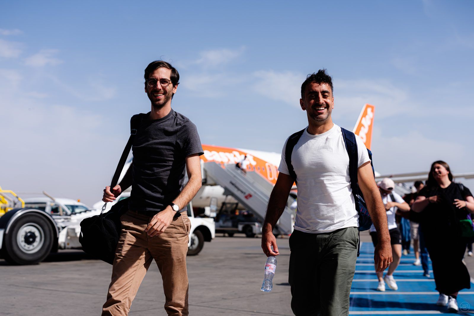 Naboo team members walking across the airport tarmac after landing for the company offsite in Marrakech