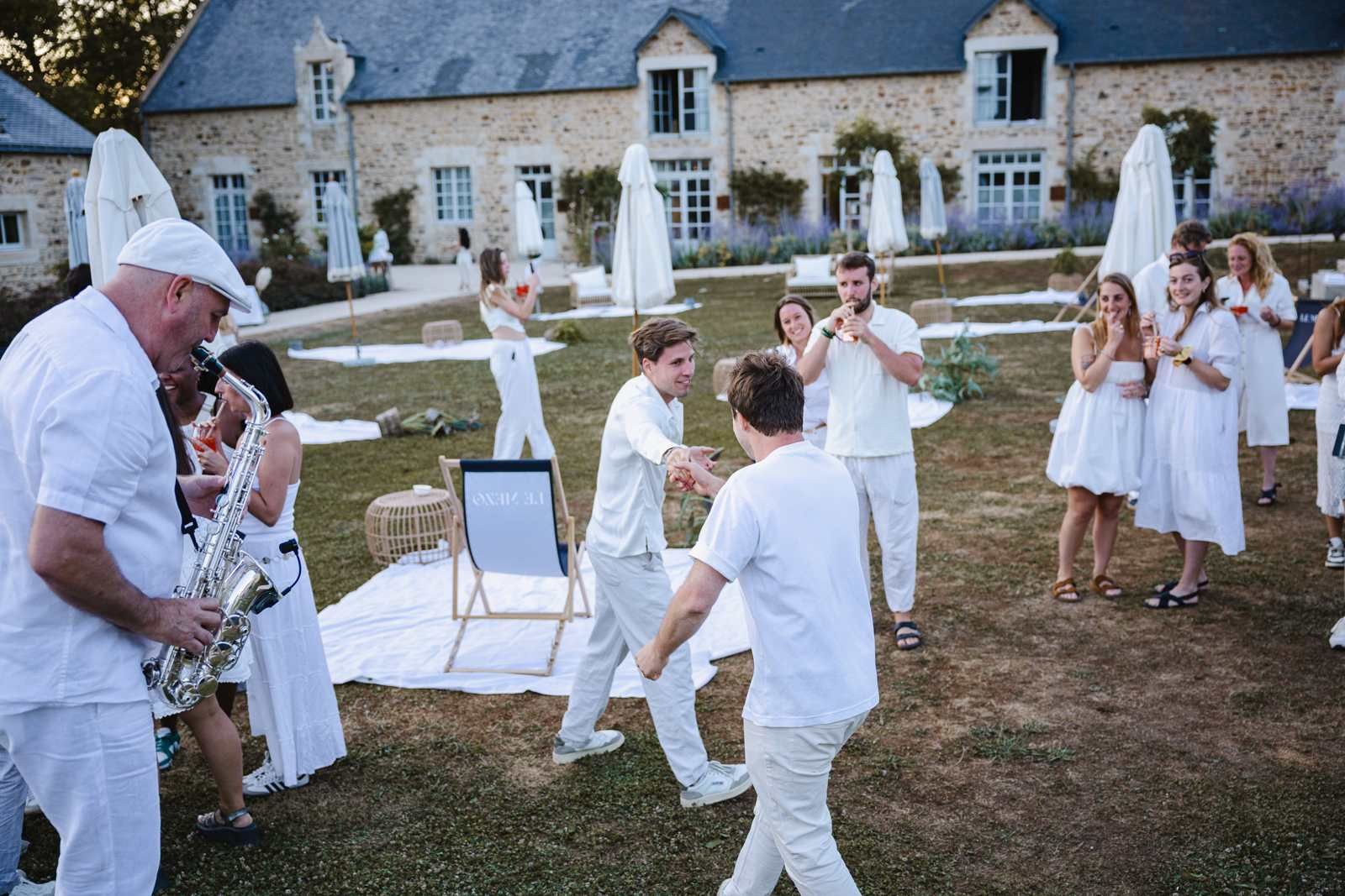 Naboo colleagues gathered on the lawn of the chateau venue during the July 2025 company seminar