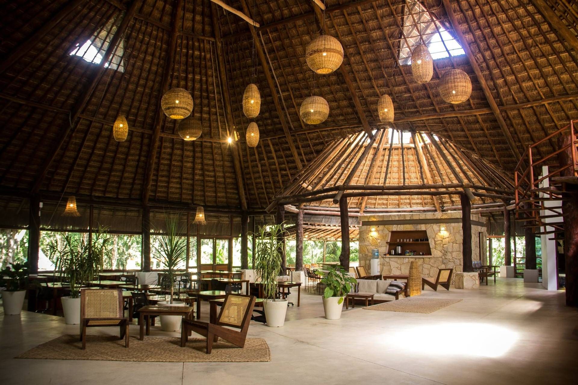 Palapa-roofed resort lounge in Tulum, Mexico